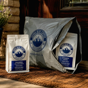 Sierra Blue Coffee Subscription with whole-bean coffee bags and shipping package